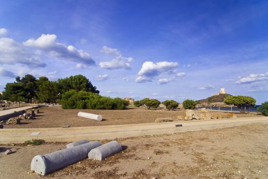 Ancient Sardinian ruins of Nora with sea and lighthouse