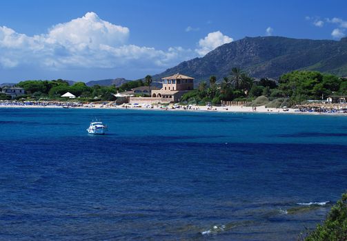 Beauitiful bay of Nora on Sardinia with yacht and blue sky