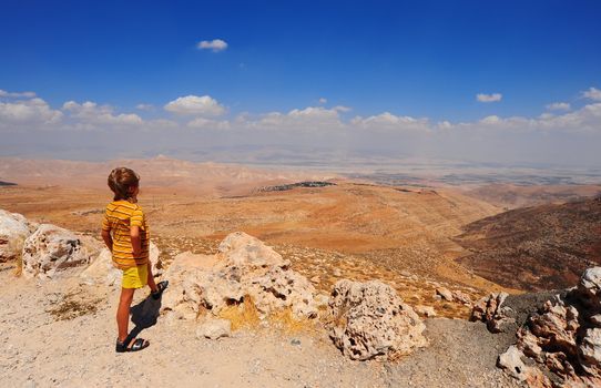 Boy Looking At The Judea Mountains Near Dead Sea.