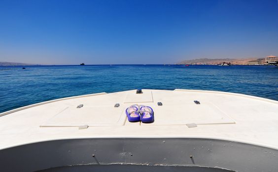 Prow Of White Boat With Flip-flops In The Red Sea