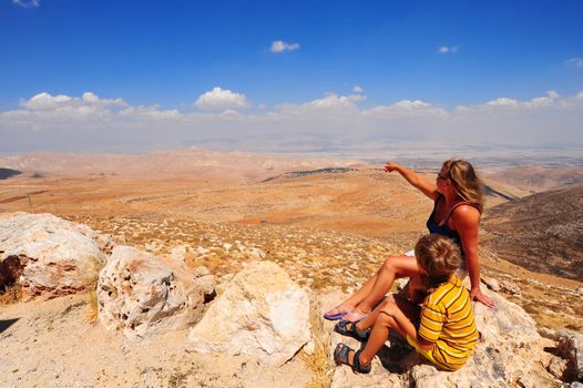 Boy And Woman Looking At The Judea Mountains Near Dead Sea