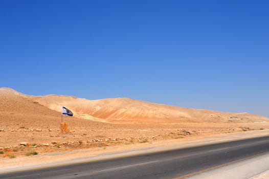 Israel Flag Near Empty Highway In Jordan Valley.