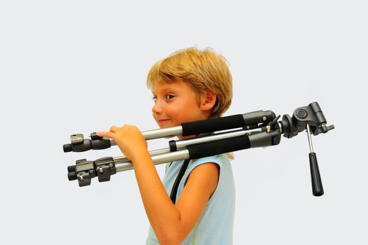 Lovely Young Photographer With Tripod Against White Background