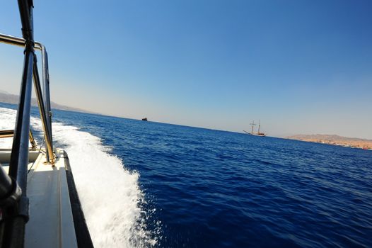 Motorboat Changing Course And Leaving Curved Wake Behind. Gulf Of Agaba.