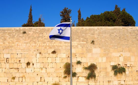 Israel Flag Against Wailing Western Wall.
 Jerusalem, Israel.
