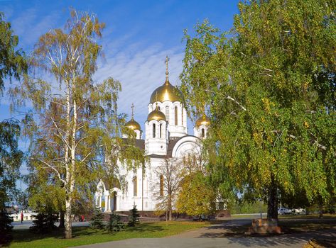Fine orthodox church among turning yellow trees