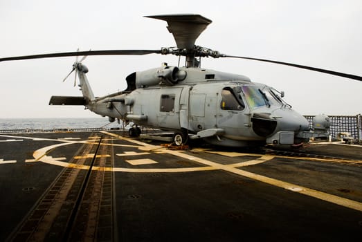 US Navy rescue helicopter on the flight deck of a flight 2 US Destroyer. (USS Chafee, DDG90)