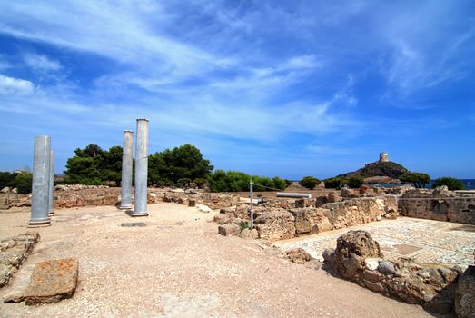 Ancient Sardinian ruins of Nora with sea and lighthouse