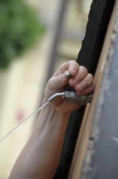 a barrel tap being turned on
