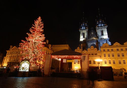 Old Town Square in Prague with Tyn Cathedral during the Christmas celebrations at night with long exposure