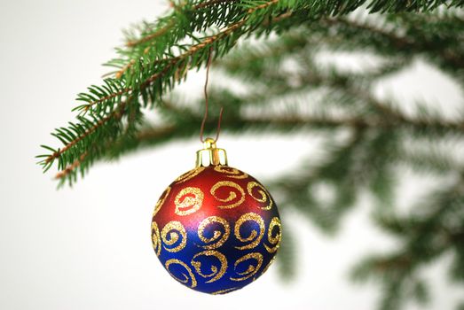 Christmas tree with colorful decoration isolated on white - shallow DOF
