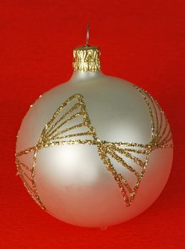 Silver christmas ball  on the red background