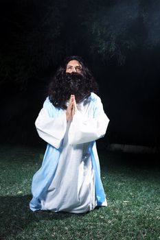 Jesus or other holy man praying and looking heavenward.