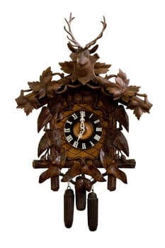 Old wooden cuckoo clock isolated on a white background.