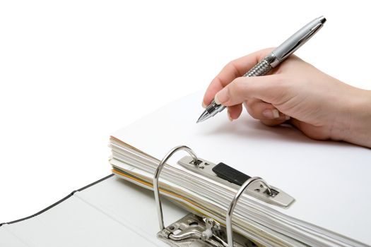 Woman writing on a document in a ring binder. White background.