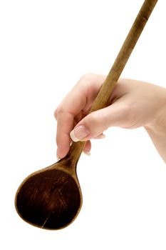 Female hand holding a wooden spoon. Isolated on a white background.