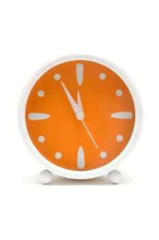 Simple alarm clock showing five minutes to midnight. White background.