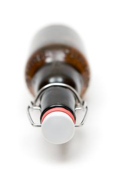 Bottle of beer. White background. Shallow depth of field.