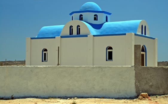 Typical Greek church - white walls and a blue cupola