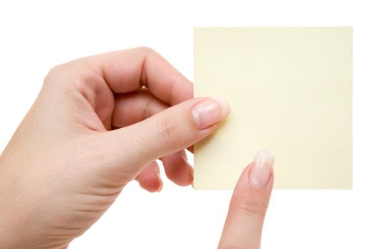Female hand holding a note. Isolated on a white background.