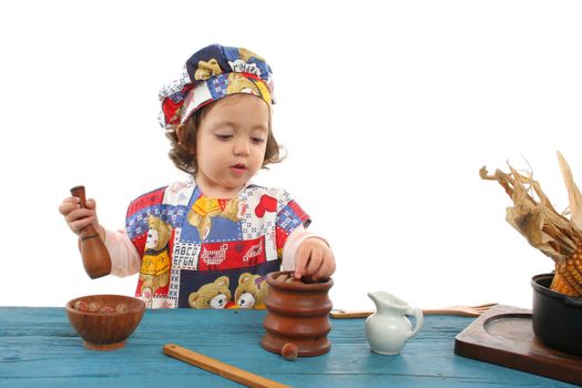 Cute toddler cooking dressed as a chef. More pictures of this baby at my gallery
