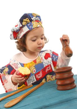 Cute toddler cooking dressed as a chef. More pictures of this baby at my gallery
