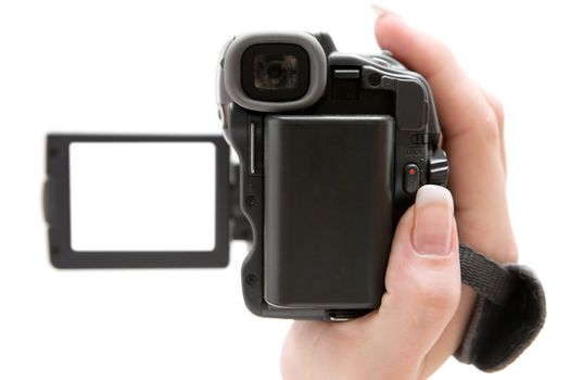 Woman holding a small camcorder. Shallow depth of field. Focus on the back of the camera. Isolated on a white background.