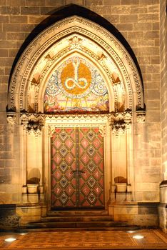 Illuminated portal of a czech cathedral on Vysehrad in the night