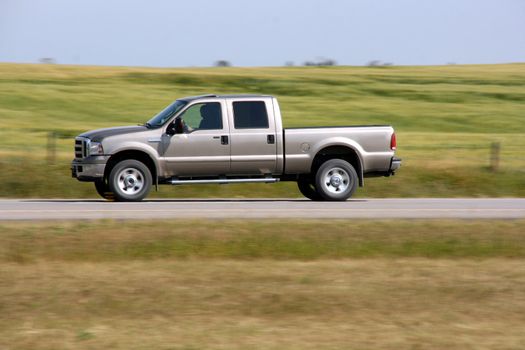 Pick up truck in motion. Speed blur. Road abstract.