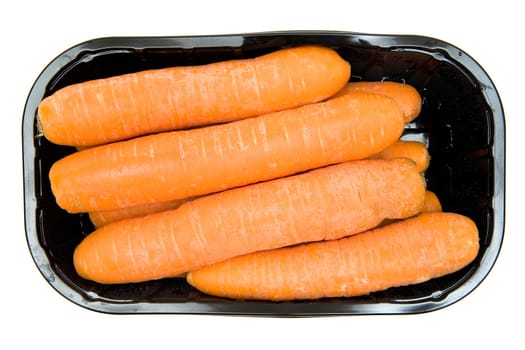 Bunch of carrots in a black box. Isolated on a white background.