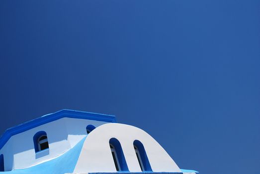 Roof of a Greek church against the blue sky 