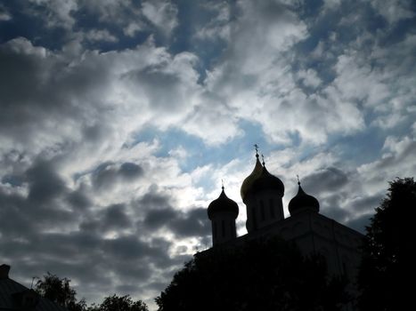 Churchs of Pskov on cloudy sky background