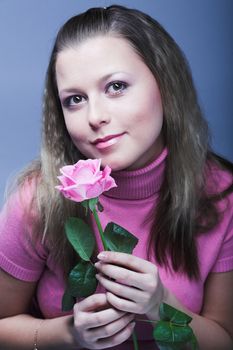young woman with pink rose