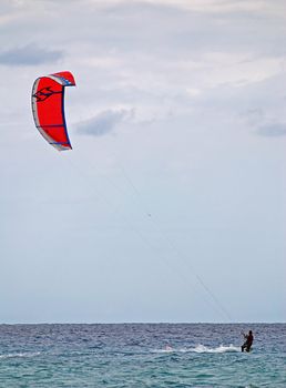 Kite surfer is enjoying windy weather on Sardinia