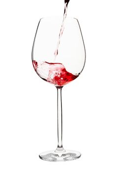 Pouring wine to glass on white background, clipping path included.