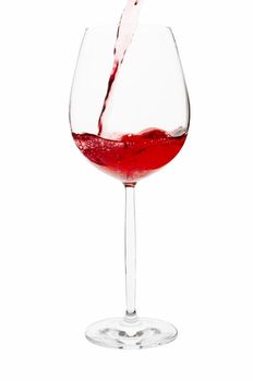 Pouring red wine to glass, clipping path included.