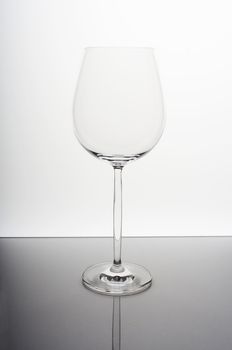 Empty wine glass on white background