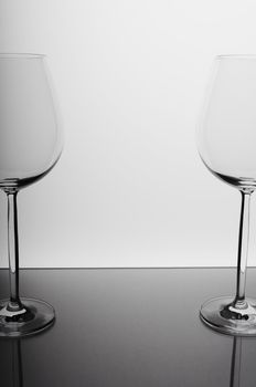 Two wine glasses against white background