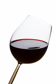 Red wine glass on isolated white background