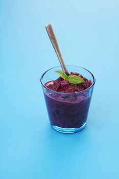 Glass of home made bilberry yogurt with bread crumbs