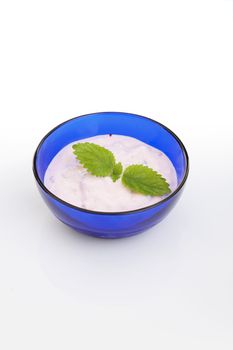 bowl of home made berry yogurt over a white background