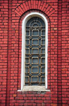 White Window On The Dark Red Brick Wall