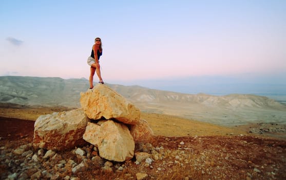 Woman Posing On The Judea Mountain Top At Sunset