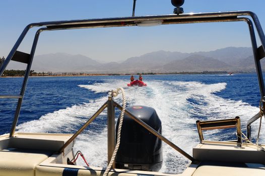 View From Cutter To Banana Boat And Foam Trail