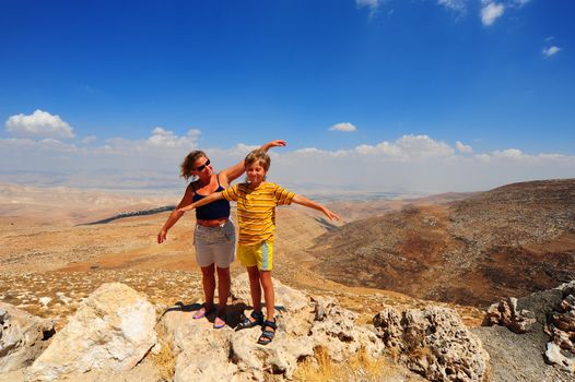 Woman And Boy  Posing On The Judea Mountain Top 