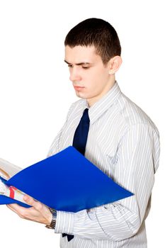 The young man in a striped shirt reads documents in a  blue folder
