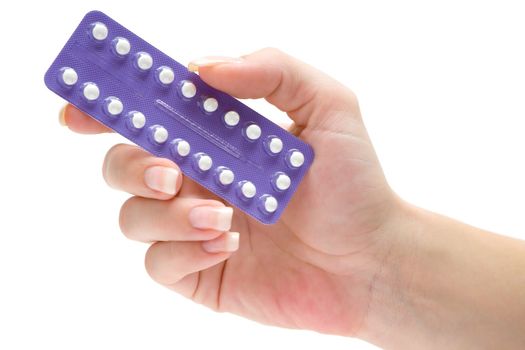 Woman holding contraceptive pills. Isolated on a white background.