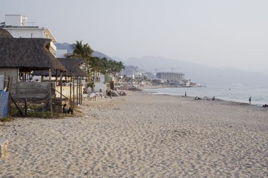 Beach with hotels and businesses in puerto vallarta mexico