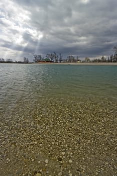 Rays of light comming through cloud over lake