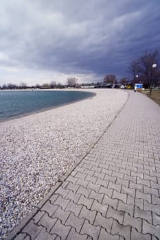 Path around the lake with clouds